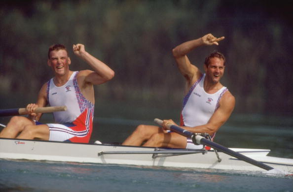 Steven Redgrave and Mathew Pinsent signal victory after a win in the Coxless Pairs event
